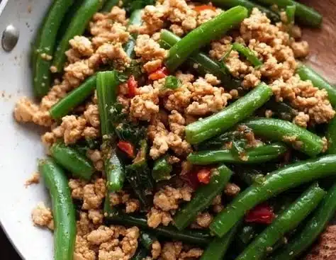 Delicious ground chicken recipe served in a bowl with vegetables and herbs