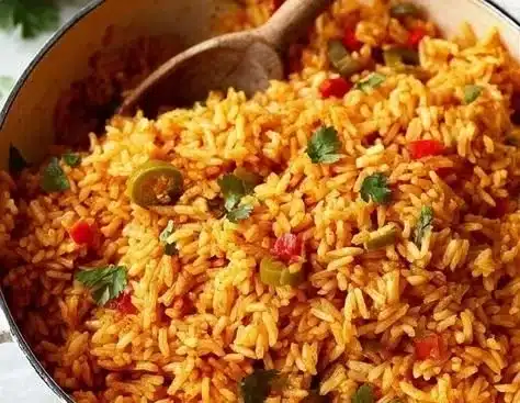 A bowl of colorful Spanish rice with peppers and spices, perfect for any meal.