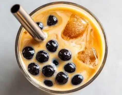 A refreshing cup of boba tea with colorful tapioca pearls and fruity flavors.