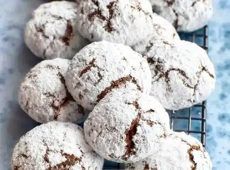 Plate of delicious Chocolate Snowball Cookies dusted with powdered sugar