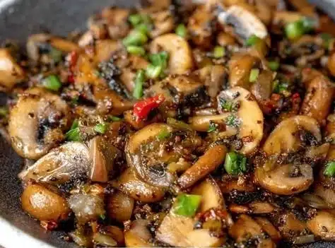 Plate of Cowboy Mushrooms garnished with herbs and spices