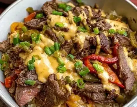 Delicious Philly Cheesesteak Bowl with meat, cheese, and toppings